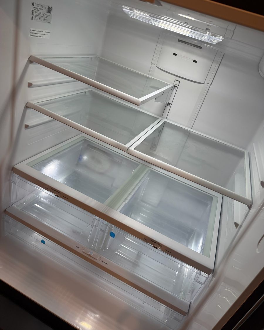 Clean refrigerator interior with glass shelves