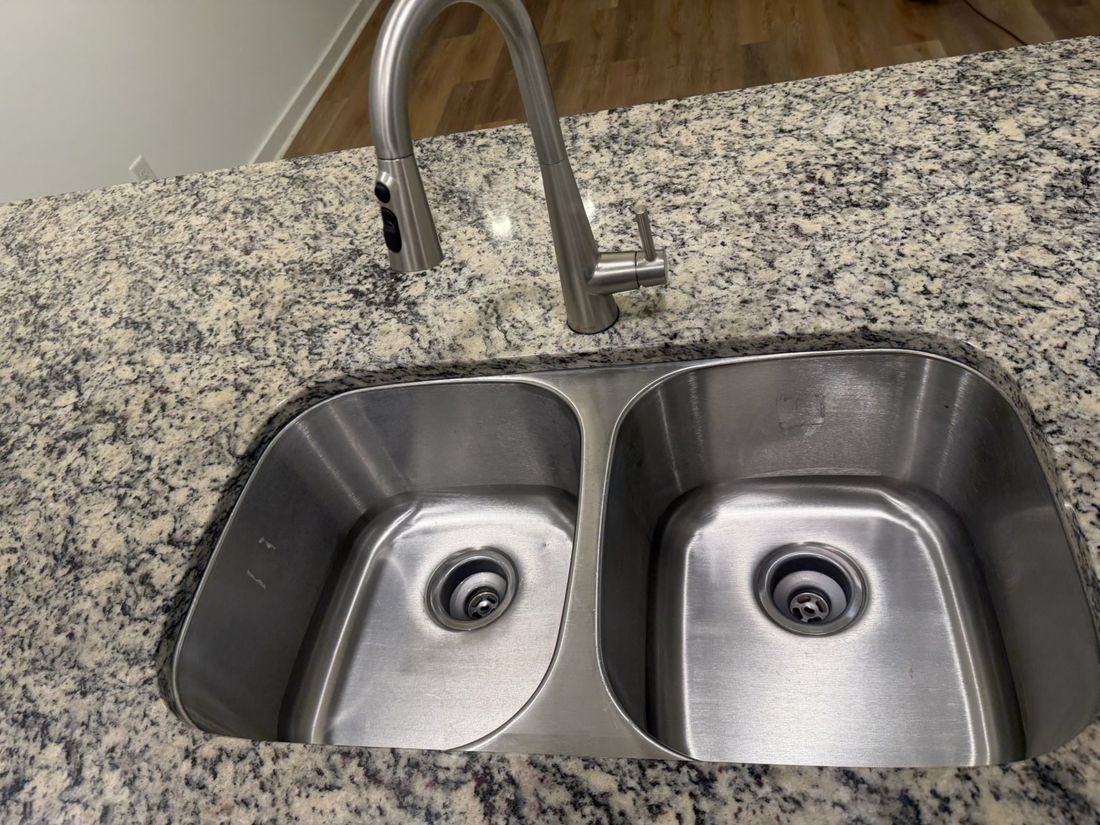 Shining stainless kitchen sink and faucet