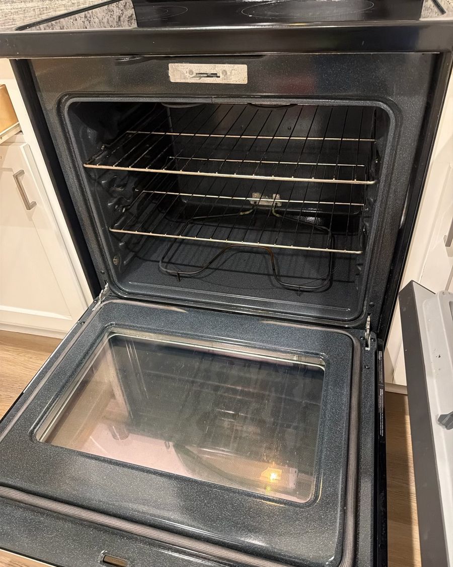 Clean oven interior with racks and door glass
